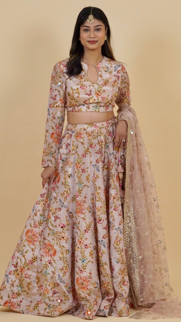 Woman wearing a floral outfit with a beige background