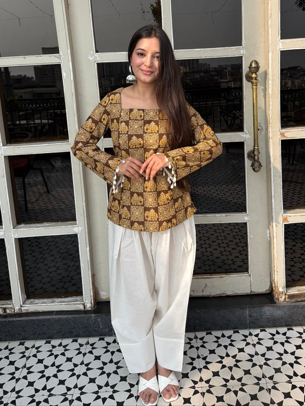 Woman standing in front of a glass door with a patterned floor.